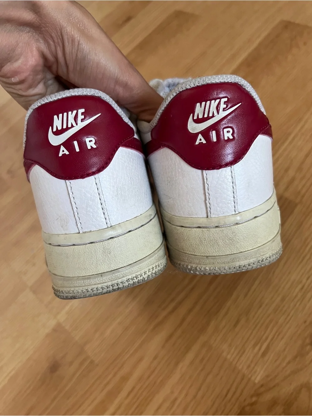 Nike White Sneakers with Red Swoosh Accents